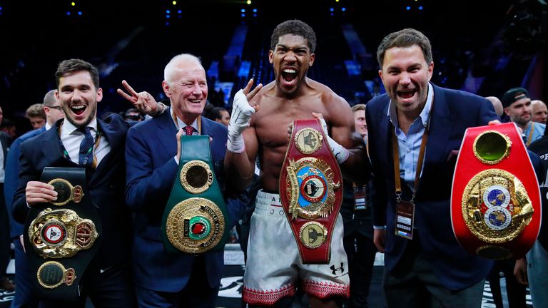 Boxing - Andy Ruiz Jr v Anthony Joshua - IBF, WBA, WBO & IBO World Heavyweight Titles - Diriyah Arena, Diriyah, Saudi Arabia - December 7, 2019. Anthony Joshua celebrates winning his match against Andy Ruiz Jr with promoter Eddie Hearn and Barry Hearn. Action Images via Reuters/Andrew Couldridge
