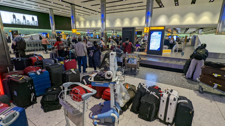 People waiting to collect their luggage at Heathrow Terminal 2. Pics: Nadir Coowar