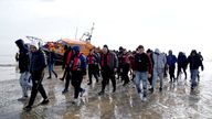 A group of people thought to be migrants are brought in to Dungeness, Kent, onboard the RNLI Dungeness Lifeboat, following a small boat incident in the Channel. Picture date: Tuesday May 17, 2022.
