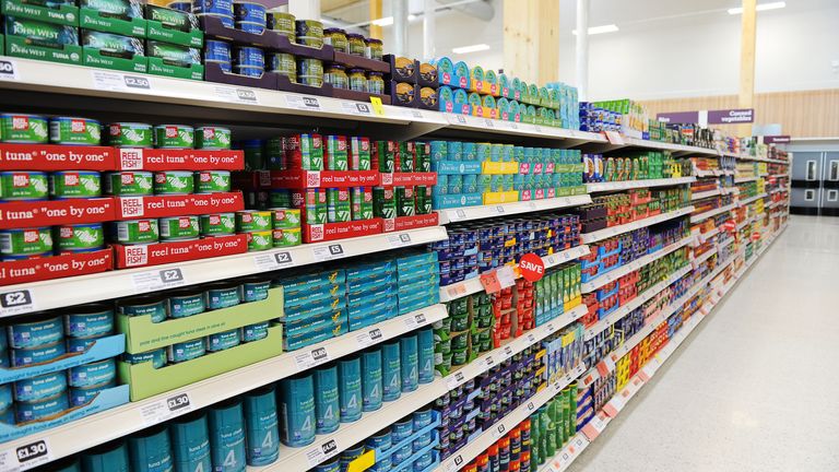 Supermarket interior showing tinned fish, Britain, UK -  