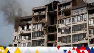 Smoke rises over a residential building damaged by a Russian missile strike in Kyiv