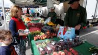 A man sells vegetables at his fruit and vegetable stall at Alsager market, Stoke-on-Trent, Britain, August 7, 2019. REUTERS/Andrew Yates