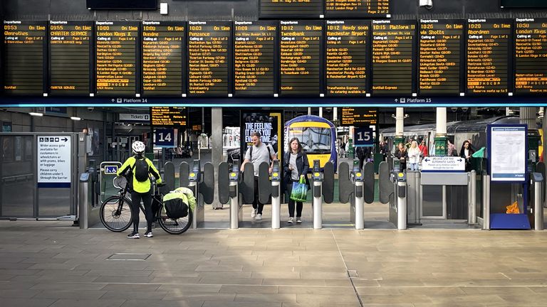 Commuters and travellers at Edinburgh's Waverley Station. ScotRail's new timetable, which will see almost 700 fewer train services a day across Scotland, begins today whilst the deadlock over driver pay continues. Picture date: Monday May 23, 2022.
