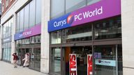 currys
 People walk by Currys PC World computer shop in Leeds, UK. The store chain is owned by Dixons Carphone, a British group.
