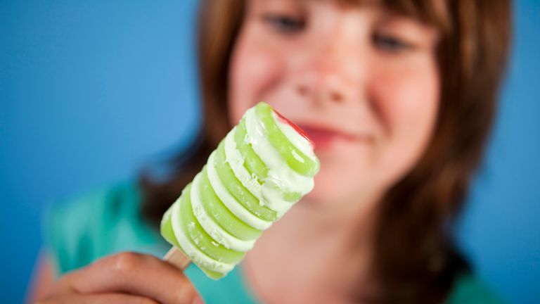 A young girl enjoys a Walls Twister ice-lolly, a Unilever brand. (Newscast Limited via AP Images)