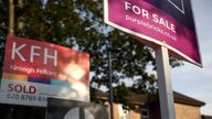 Property estate agent sales and letting signs are seen attached to railings outside an apartment building in south London, Britain, September 23, 2021.