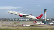 EDITORIAL USE ONLY Virgin Atlantic flight VS3 (front) and British Airways flight BA001 (back) perform a synchronised departure on parallel runways at London Heathrow Airport, heading for New York JFK to celebrate the reopening of the transatlantic travel corridor, more than 600 days since the US travel ban was introduced due to the Covid-19 pandemic. Picture date: Monday November 8, 2021.