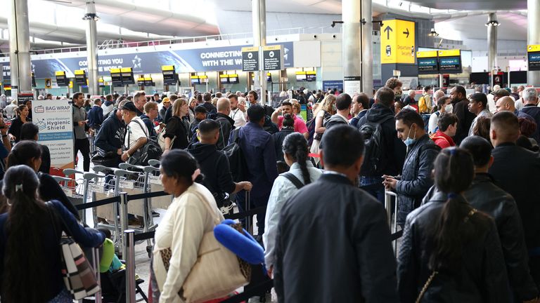 Passengers queue inside the departures terminal of Terminal 2 at Heathrow Airport in London, Britain, June 27, 2022. REUTERS/Henry Nicholls
