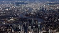 2019 - Canary Wharf and the City of London financial district are seen from an aerial view in London, Britain, August 8, 2019. REUTERS/Hannah McKay
