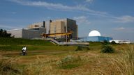 A cyclist travels away from Sizewell A and B power stations in Suffolk