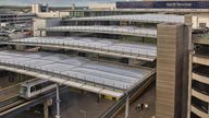 London Gatwick Airport North Terminal, Sussex, England, UK. August 2020, early morning. Aerial view of the North Terminal at Gatwick Airport showing terminal buildings, car park and shuttle train departing. Pic: iStock