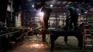  Matt Dillion and Chad Damron weld an upper deck assembly at Look Trailers cargo trailer manufacturing facility in Middlebury, Indiana, U.S., April 1, 2021. REUTERS/Eileen T. Meslar/File Photo