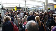 Passengers queue inside the departures terminal of Terminal 2 at Heathrow Airport in London, Britain, June 27, 2022. REUTERS/Henry Nicholls
