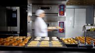 Baker on the move baking bread during rush hour at the bakery 