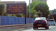 A weather travel warning for Monday and Tuesday is displayed on a road information panel on the A13 near Beckton in east London. Temperatures are predicted to hit 31C across central England on Sunday ahead of record-breaking highs next week. Picture date: Sunday July 17, 2022.

