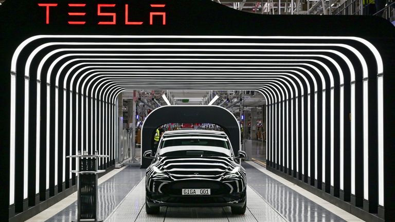 A Model Y Tesla electric vehicle stands on a conveyor belt at the opening of the Tesla Gigafactory Berlin Brandenburg.
PIC:AP