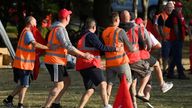 Strikers dance whilst protesting near an entrance to the UK's biggest container port Felixstowe, as workers continue an 8-day strike, in Felixstowe, Britain, August 22, 2022. REUTERS/Toby Melville
