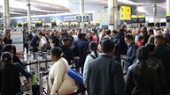 Passengers queue inside the departures terminal of Terminal 2 at Heathrow Airport in London, Britain, June 27, 2022. REUTERS/Henry Nicholls
