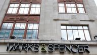 Pedestrians walk past the Marble Arch branch of Marks and Spencer in central London June 8, 2012. 