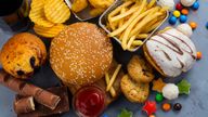 Assortment of unhealthy products that's bad for figure, skin, heart and teeth. Fast carbohydrates food. Pic: iStock