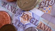 Close-up picture of sterling ten pound notes and coins (Newscast Limited via AP Images)