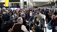 FILE PHOTO: Passengers queue inside the departures terminal of Terminal 2 at Heathrow Airport in London, Britain, June 27, 2022. REUTERS/Henry Nicholls/File Photo
