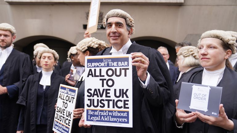 Criminal barristers from the Criminal Bar Association (CBA), which represents barristers in England and Wales, outside the Old Bailey, central London, on the first of several days of court walkouts by CBA members in a row over legal aid funding.Picture date: Monday June 27, 2022.
