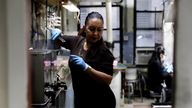 Jewellery workers are pictured through a doorway in a workshop at RFG Manufacturing Riviera jewelry design facility in Manhattan in New York City, New York, U.S., September 30, 2021. Picture taken September 30, 2021. REUTERS Mike Segar