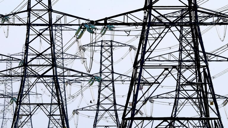 Electricity pylons carry power away from Dungeness nuclear power station in Kent as the National Grid warned that a record low demand for electricity during the UK's coronavirus lockdown could lead to windfarms and power plants being turned off to avoid overloading the electricity grid.