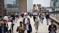 People walk across London Bridge during morning rush hour, in London, Britain, June 11, 2021. REUTERS/Henry Nicholls