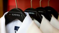 Close-up picture of white mens dinner jackets in the flagship Gieves & Hawkes store on Savile Row. (Newscast Limited via AP Images)