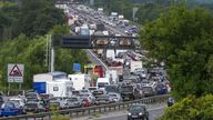 Vehicles queue on the M5 near Portbury, Bristol, as families embark on getaways at the start of summer holidays for many schools in England and Wales. Picture date: Friday July 22, 2022.