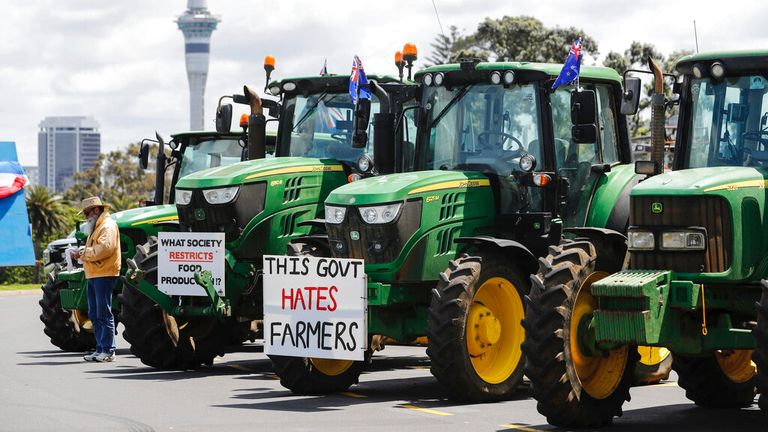 New Zealand farmers protest in central Auckland on government plans to make them pay for greenhouse gas emissions, Thursday, Oct. 20, 2022. New Zealand farmers drove their tractors to towns around New Zealand on Thursday in protest at a proposed new tax on cow burps and other farm greenhouse gas emissions. (Dean Purcell/New Zealand Herald via AP)