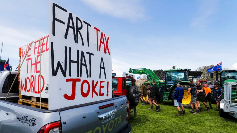 New Zealand farmers protest in central Auckland on government plans to make them pay for greenhouse gas emissions, Thursday, Oct. 20, 2022. New Zealand farmers drove their tractors to towns around New Zealand on Thursday in protest at a proposed new tax on cow burps and other farm greenhouse gas emissions. (Dean Purcell/New Zealand Herald via AP)