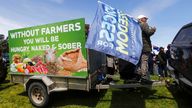 New Zealand farmers protest in central Auckland on government plans to make them pay for greenhouse gas emissions, Thursday, Oct. 20, 2022. New Zealand farmers drove their tractors to towns around New Zealand on Thursday in protest at a proposed new tax on cow burps and other farm greenhouse gas emissions. (Dean Purcell/New Zealand Herald via AP)