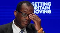 British Chancellor of the Exchequer Kwasi Kwarteng adjusts his glasses during Britain's Conservative Party's annual conference in Birmingham, Britain, October 3, 2022. REUTERS/Toby Melville