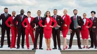 Virgin Atlantic of Michelle Visage (centre) with others modelling the Virgin Atlantic uniform options for the launch of the airline's updated gender identity policy, giving its LGBTQ plus people the option to choose which uniform best represents them