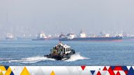 The Joint Coordination Centre officials sail through cargo ship Mehmet Bey as she waits to pass the Bosphorus strait off the shores of Yenikapi during a misty morning in Istanbul, Turkey, October 31, 2022. REUTERS/Umit Bektas