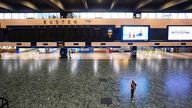 A person sweeping the floor in front of an empty departures board at Euston  station in London, as members of the drivers' union Aslef and the Transport Salaried Staffs Association (TSSA) go on strike. Picture date: Wednesday October 5, 2022.