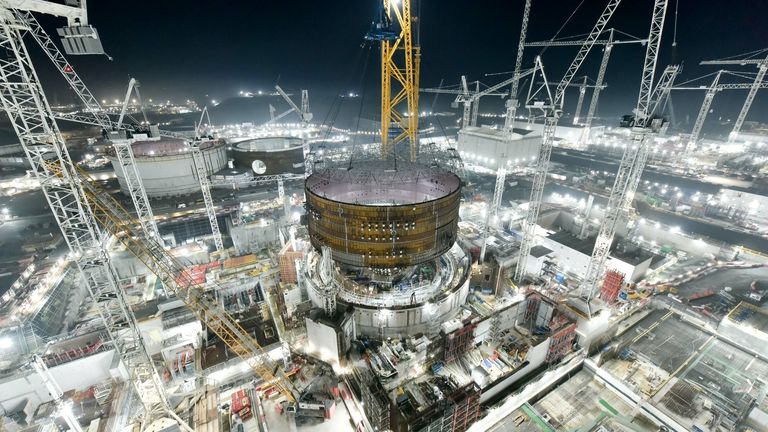 Handout photo dated 15/11/21 issued by EDF/CGN of Big Carl, the world's biggest crane, in action at Hinkley Point C nuclear power plant near Bridgwater in Somerset on Monday evening, as it placed the first huge steel ring section onto the second reactor building, just 11 months after the same operation on the first reactor. Issue date: Tuesday November 16, 2021.