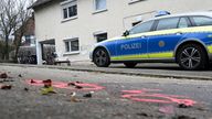 Police forensics markers are placed at a crime scene where  two girls were attacked and seriously injured on their way to school
PIC:AP