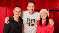 Mark Hoyle (C), his wife Roxanne and Martin Lewis recording Ladbaby's bid for Christmas number 1 - Do They Know It's Christmas?