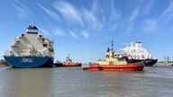 An LNG tanker is guided by tug boats at the Cheniere Sabine Pass LNG export unit in Cameron Parish, Louisiana, U.S., April 14, 2022.