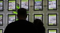 ile photo dated 18/12/16 of people looking at homes for sale in an estate agents window. The average price tag on a home in Britain has topped �350,000 for the first time, according to website Rightmove.
Read less