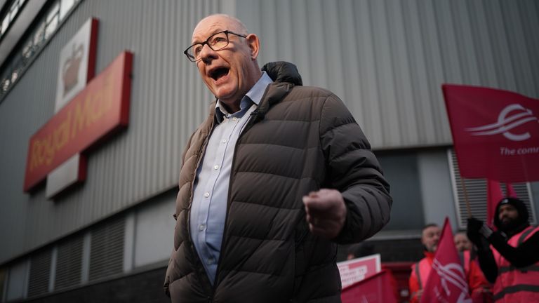 Communication Workers Union (CWU) general secretary Dave Ward speaks to the media on the picket line at the Camden Town Delivery Office in north west London