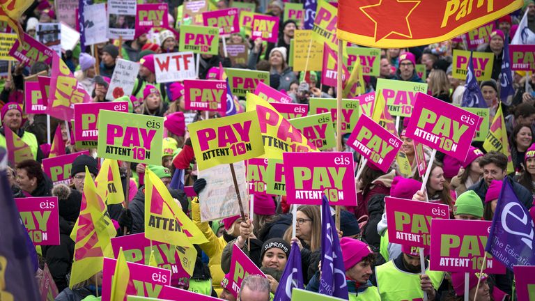 Members of the Educational Institute of Scotland (EIS) join teachers at a rally outside the Scottish Parliament in Edinburgh in a protest over pay