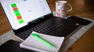 Stock photo of a laptop on a dining room table set up as a remote office to work from home. Workers told to self-isolate due to coronavirus will receive sick pay from day one, the Prime Minister has announced, as England's Chief Medical Officer warned that a UK epidemic is now 