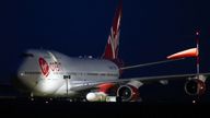 Cosmic Girl, a Virgin Boeing 747-400 aircraft sits on the tarmac with Virgin Orbit's LauncherOne rocket attached to the wing, ahead of the first UK launch tonight, at Spaceport Cornwall at Newquay Airport in Newquay, Britain, January 9, 2023. REUTERS/Henry Nicholls