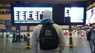 A man looks at the departures board at Euston train station in London during a strike by members of the Rail, Maritime and Transport union (RMT) in a long-running dispute over jobs and pensions. Picture date: Wednesday December 14, 2022.
