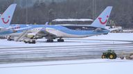 A tractor clearing snow at Manchester Airport. People across many parts of the country are bracing themselves for few days of travel disruption as snow, ice and bitterly cold temperatures grip the nation. Picture date: Thursday January 19, 2023.